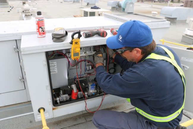 VETS Service Technician working on Roof top uint